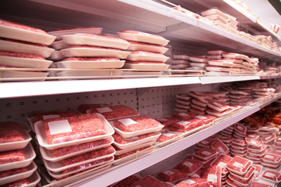 Ground beef on shelves in a supermarket